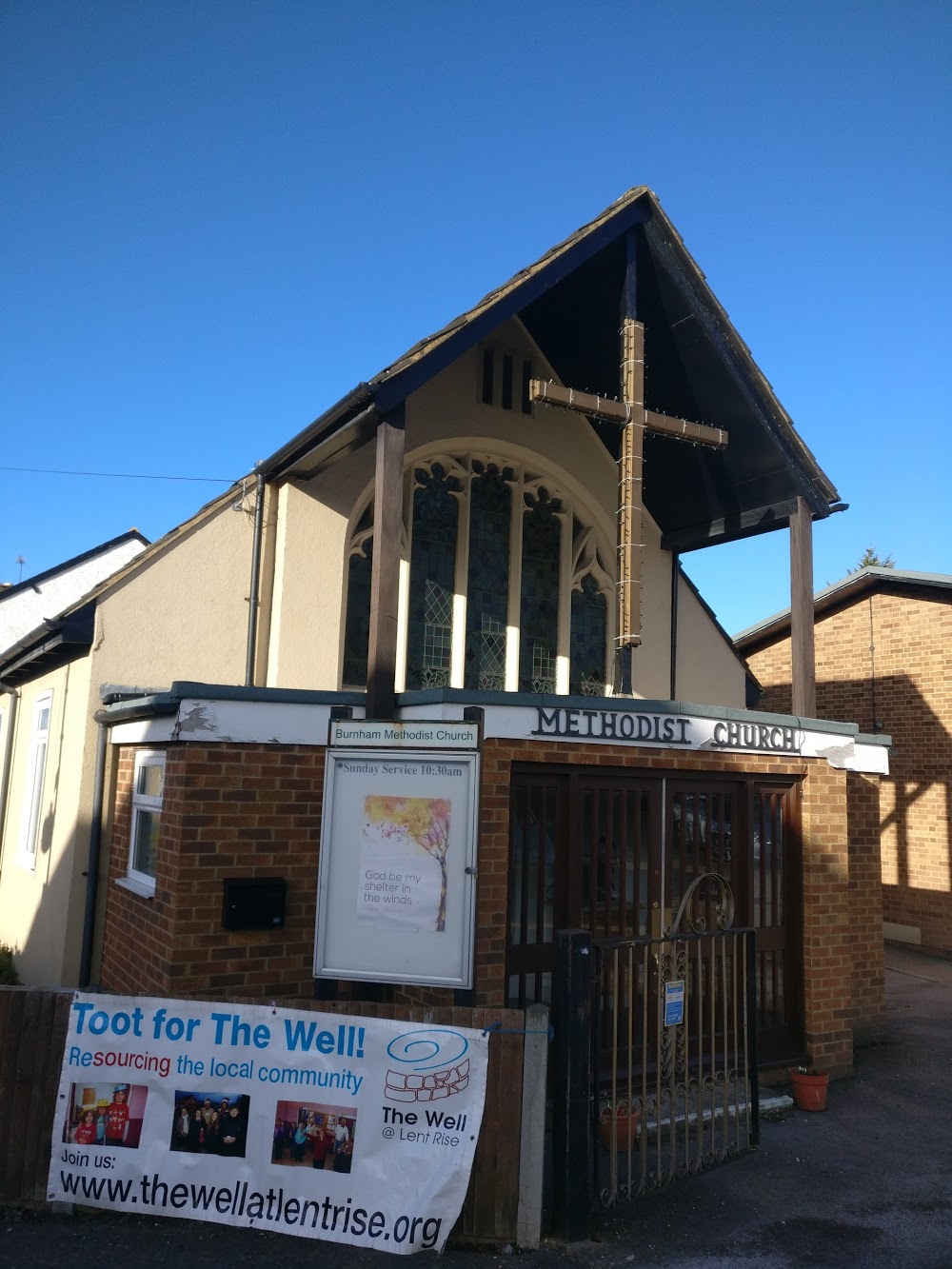 The Well poster hanging on the gate outside